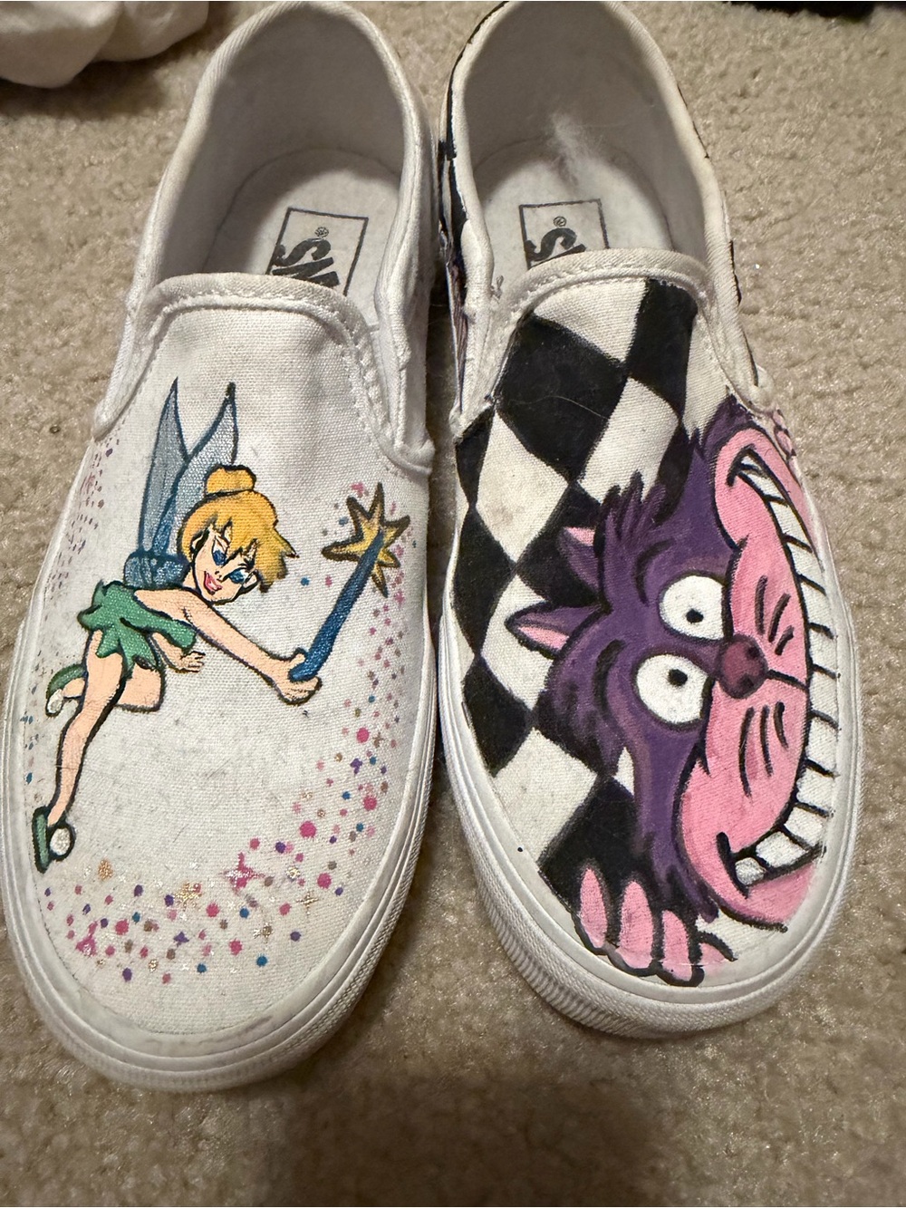 Vans White Canvas Slip-Ons with Tinker Bell and Cheshire Cat Artwork